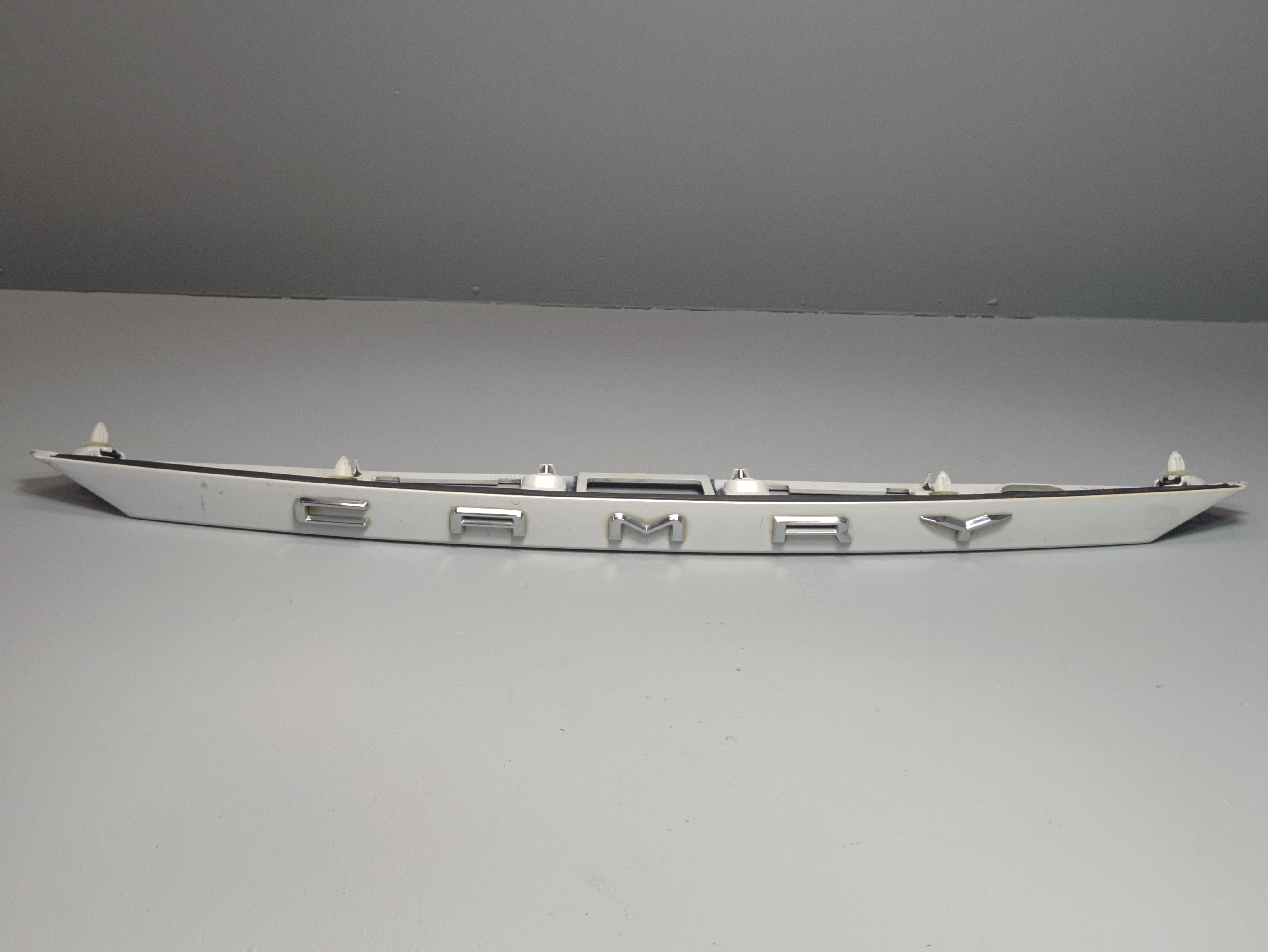 2018-2024 Toyota Camry Rear trunk Deck Lid License Plate Molding White OEM